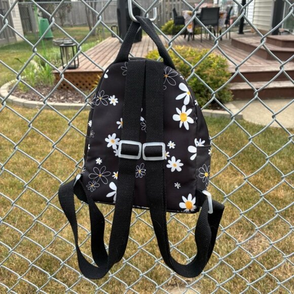 Like Dreams Nylon Mini Black Daisy Floral Backpack With Fur Ball Charm - Picture 3 of 12